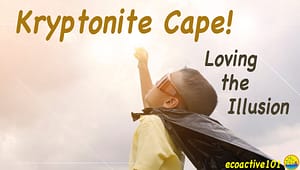 A young boy wearing a black garbage-bag cape looks up at the sky. Large text says, “Kryptonite Cape! Loving the Illusion.”